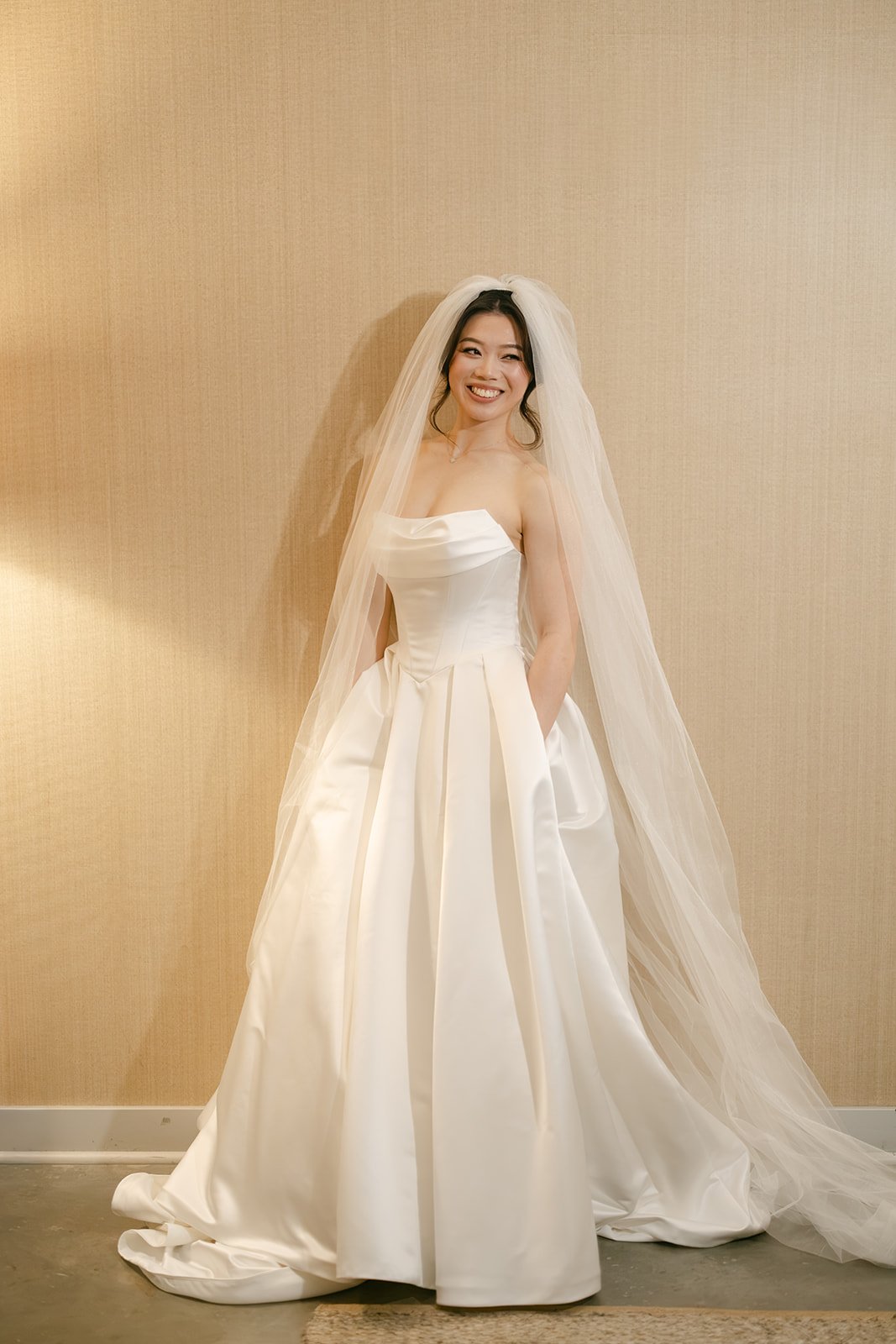 Bride in a satin gown and full-length veil with bridal makeup by Tian Soon Makeup in Perth