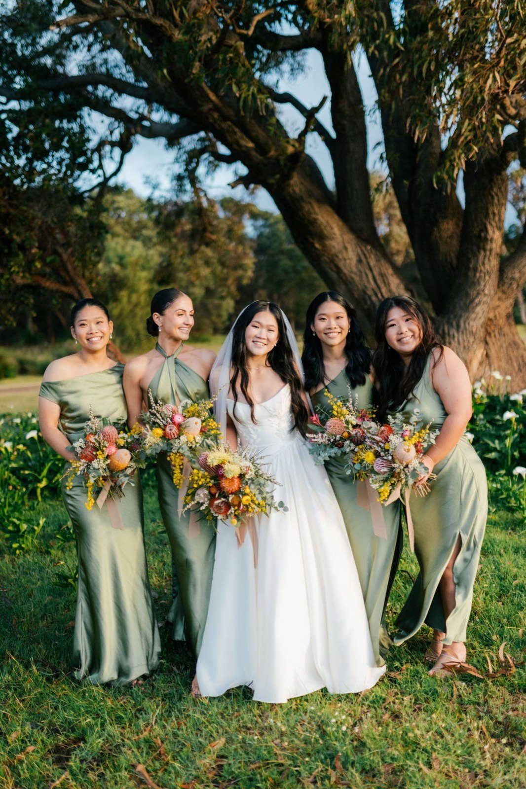 Bride Yvonne with her four bridesmaids under a eucalyptus tree, bridal makeup by Tian Soon